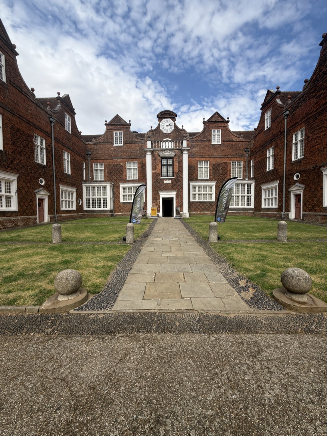 The historic brick facade and entrance of Christchurch Mansion