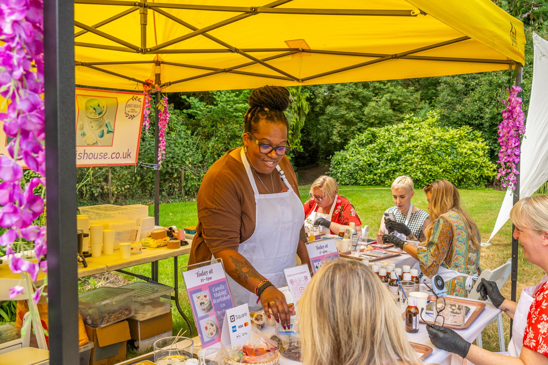 Visitors enjoying a candle-making workshop at the Craft Show