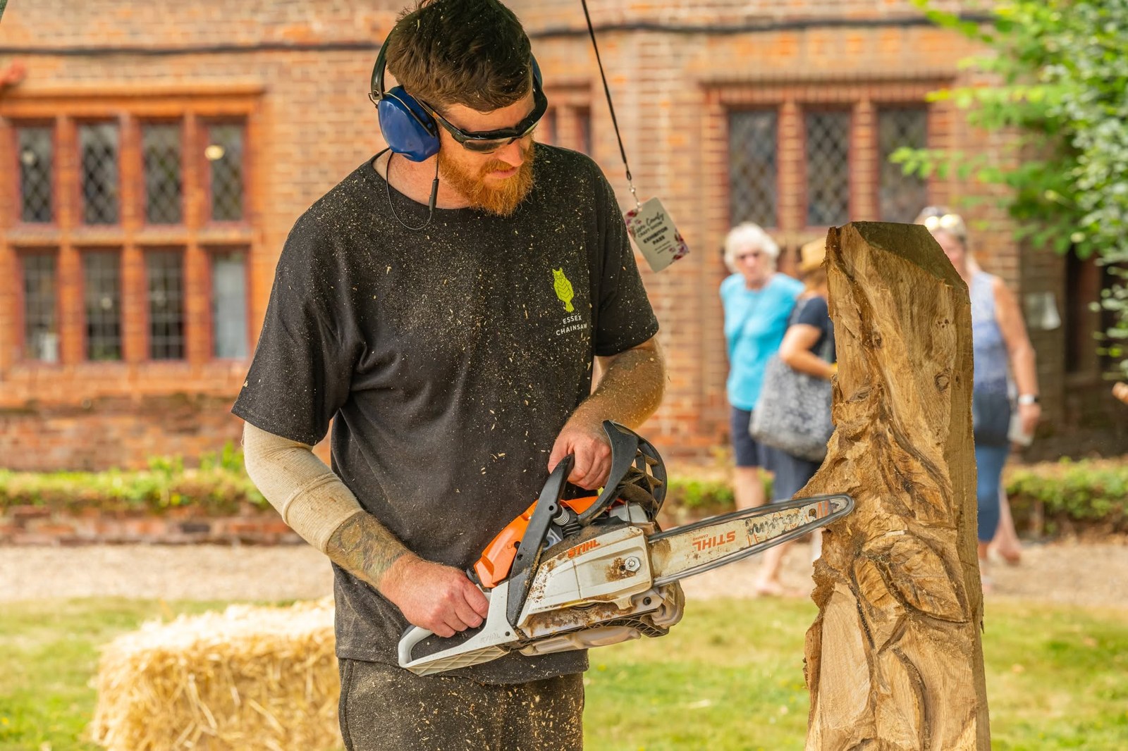A craftsman demonstrating chainsaw carving at Ingatestone Hall
