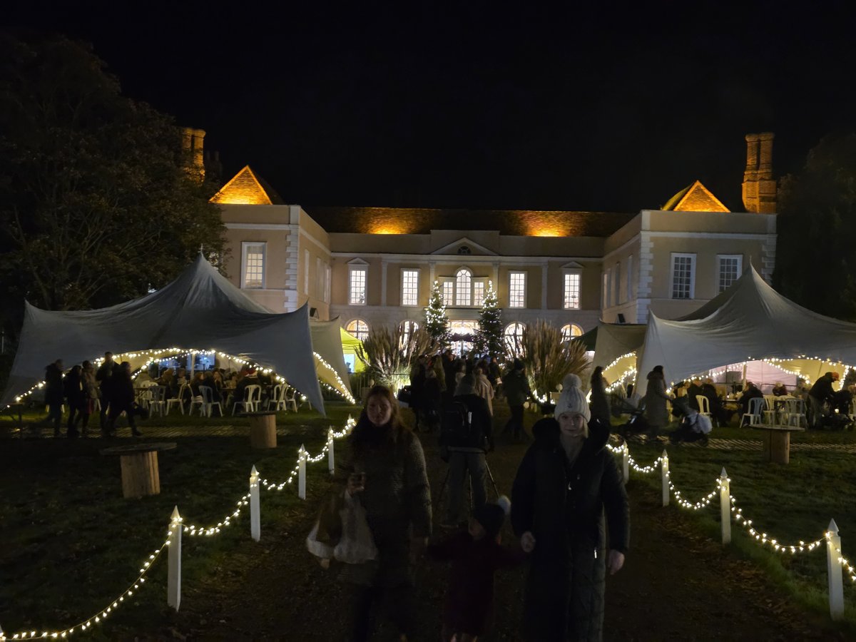 Hintlesham Hall illuminated at night during the Christmas fair