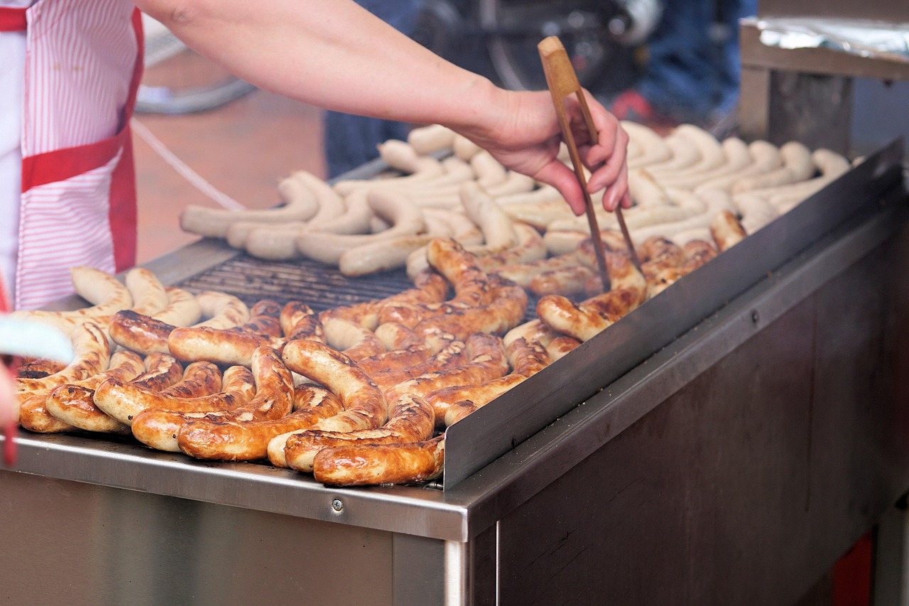German bratwurst sausages cooking on a grill