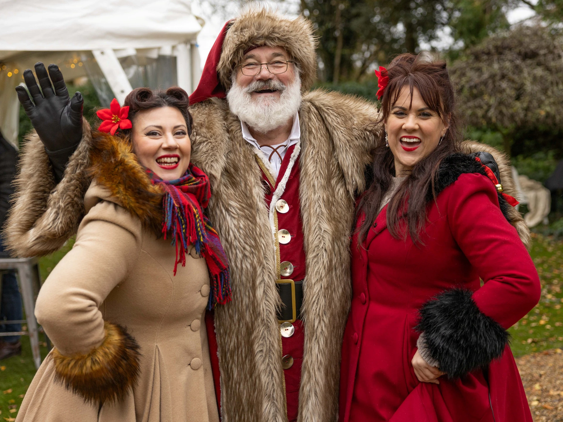 Father Christmas with two Harmonettes singers
