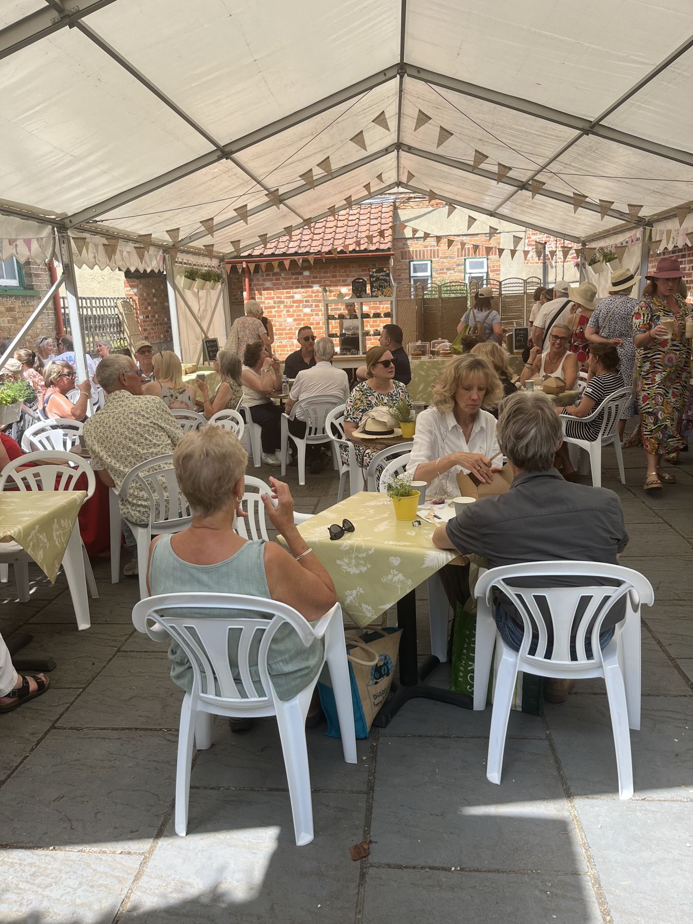 Visitors enjoying refreshments and conversation in Ingatestone Hall’s tea room