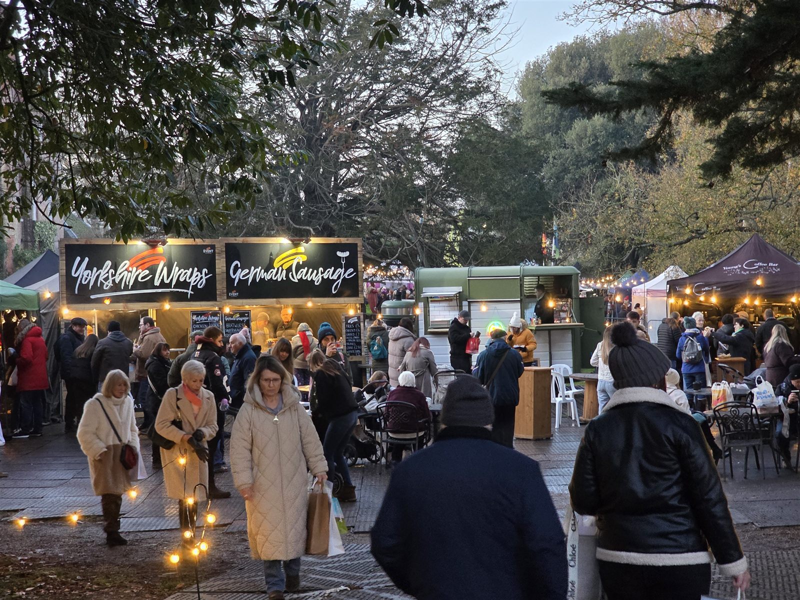 Visitors enjoying outdoor food stalls at Suffolk County Christmas Fair
